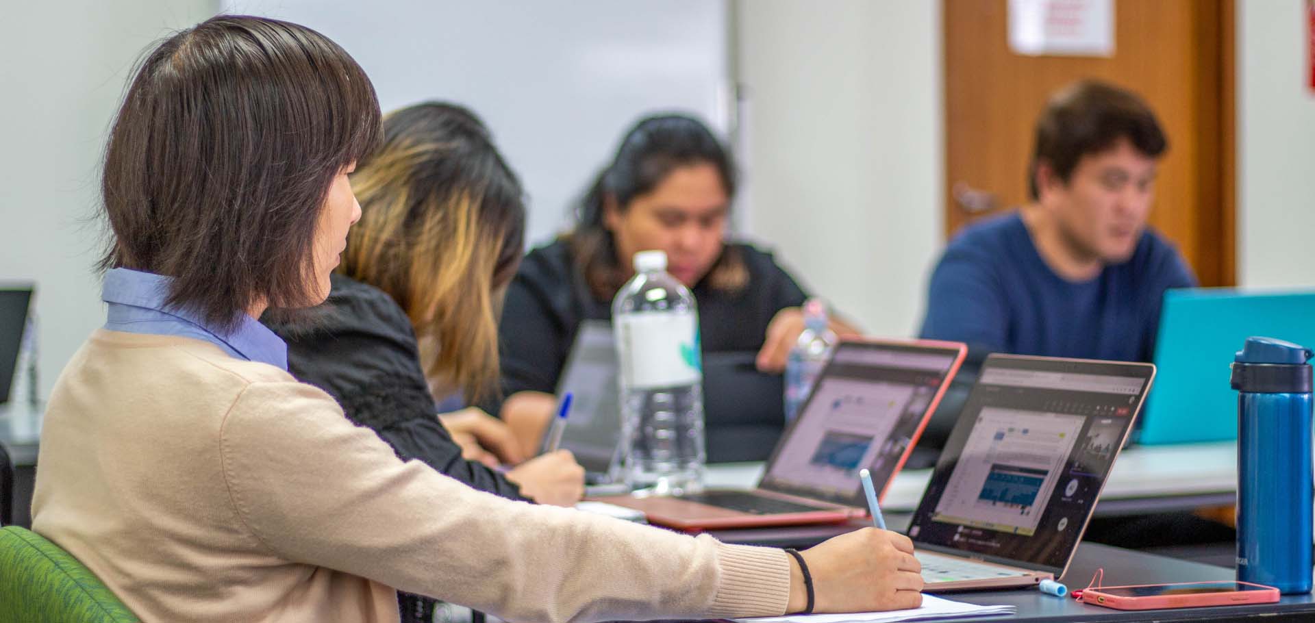 Students studying with laptops