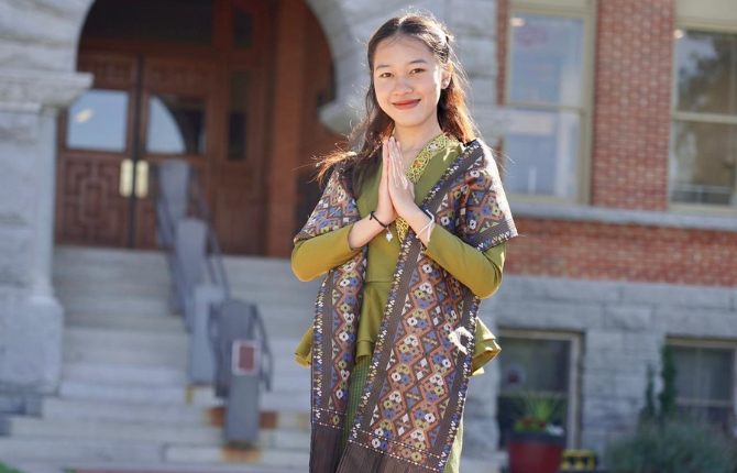 girl standing in front of a building